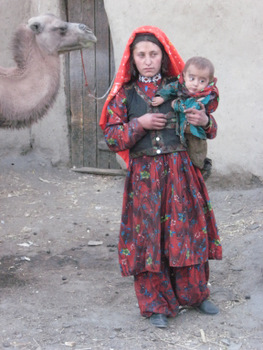 afghanistan woman and camel