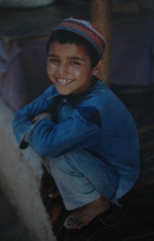 smiling afghan boy